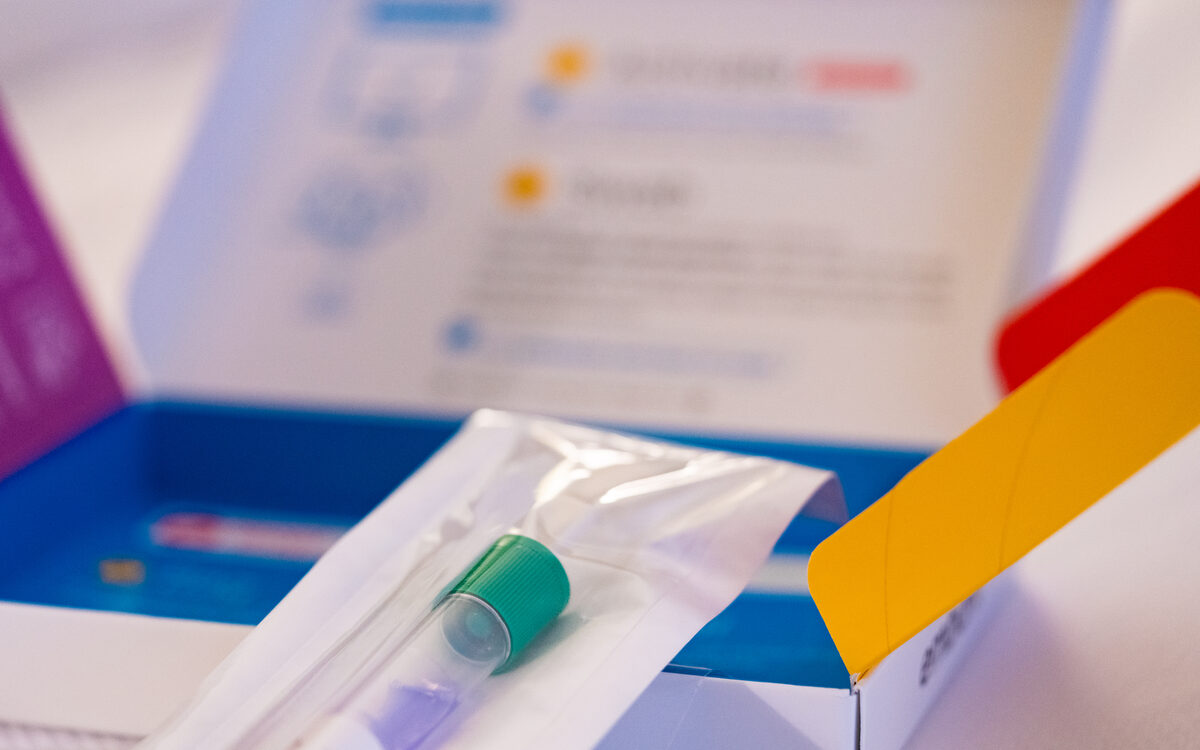 A home DNA testing kit with a saliva collection tube